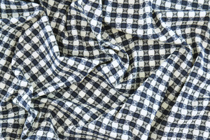 Cotone stretch a quadri bianco blu con motivo jacquard