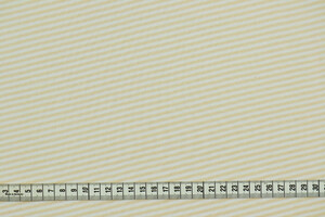 Jersey di cotone stretch a righe diagonali bianco e pesca chiaro