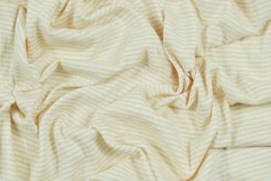 Jersey di cotone stretch a righe diagonali bianco e pesca chiaro