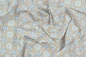Popeline puro cotone motivo geometrico ocra e blu